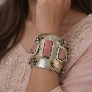 Wide hammered silver cuff with three pink stones.