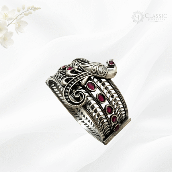 Silver peacock cuff with pink stones