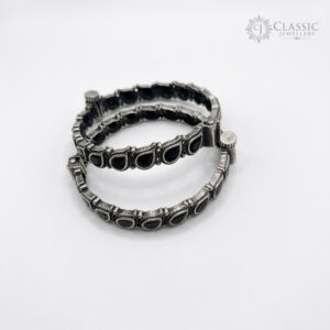 Pair of German silver antique kadas with teardrop black stones by Classicjewellery