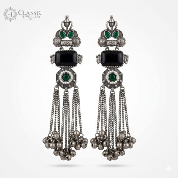 Handcrafted German silver long drop earrings with black stones and ruby accents featuring ghungroo tassels by Classicjewellery