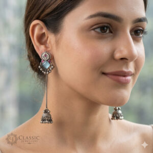 Model wear German Silver Green Stone Long Jhumka Earrings