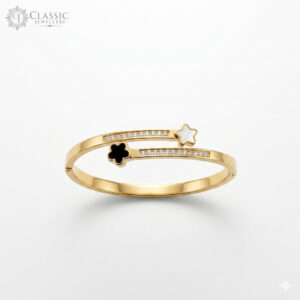 Gold-plated bypass bangle featuring a white shell star, a black onyx-style clover, and crystal-studded accents.