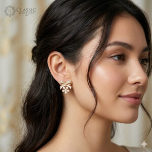Mpdel Wear Cute gold-plated bow stud earrings with a pearl flower drop and crystal accents by Classicjewellery