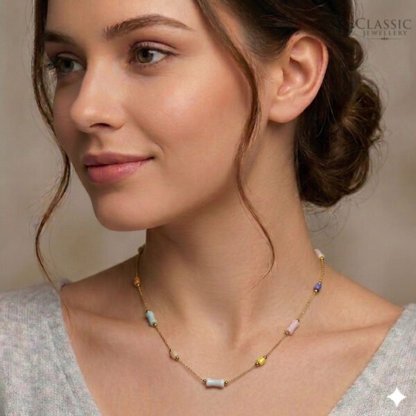 Model wear Dainty gold chain necklace featuring cylindrical pastel-colored beads in pink, blue, yellow, and purple by Classicjewellery