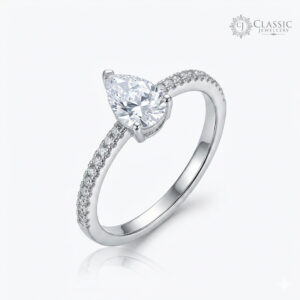 Elegant pear-shaped diamond solitaire silver ring with a crystal-studded band by Classicjewellery