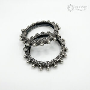 Set of two textured silver kadas with pearls