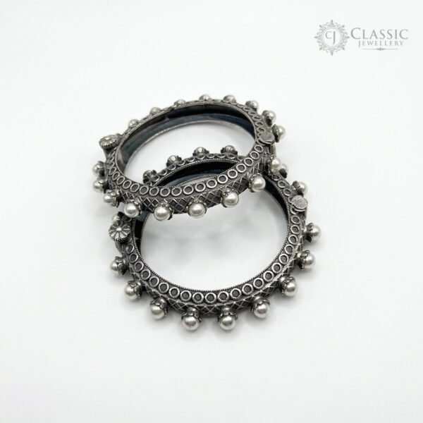 Set of two textured silver kadas with pearls