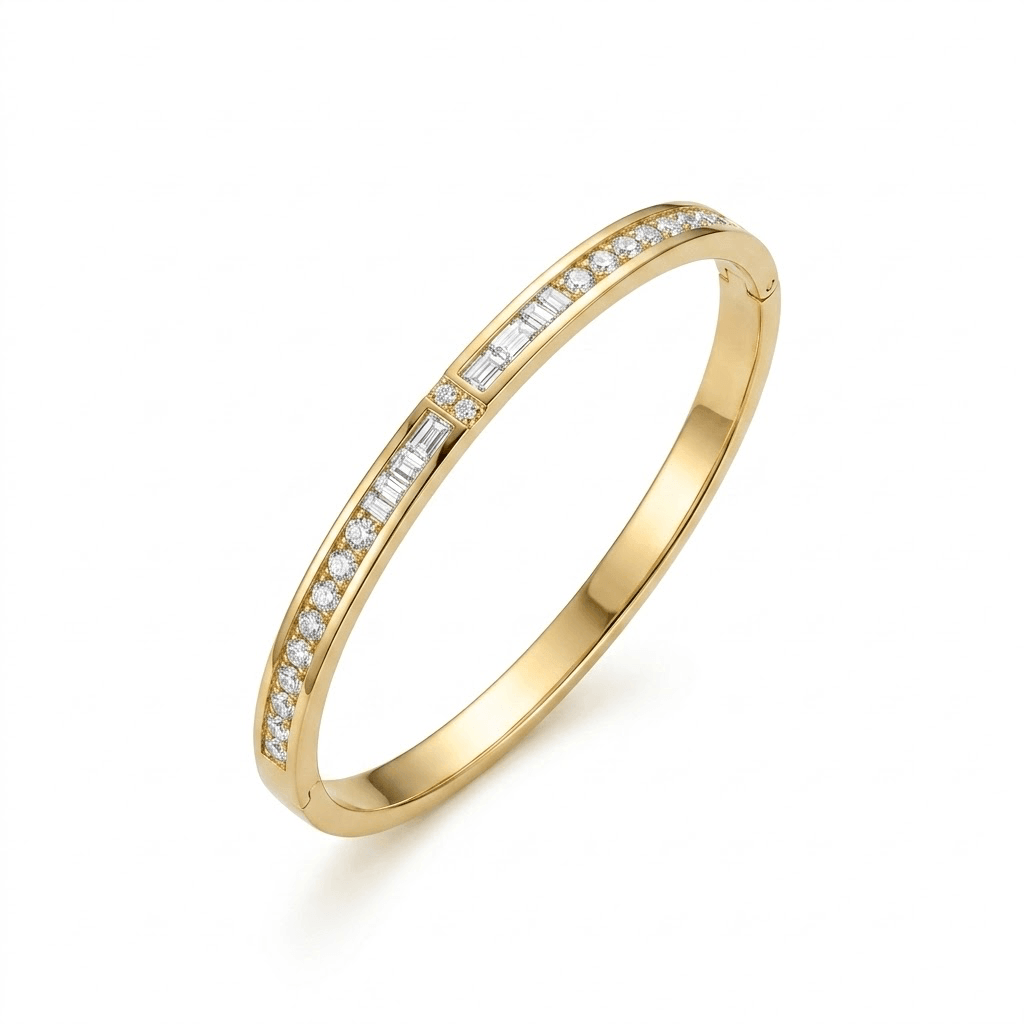 A sleek, polished yellow gold hinged bangle bracelet featuring a central channel of rectangular baguette-cut diamonds, flanked on both sides by rows of round brilliant-cut pave diamonds on a plain white background.