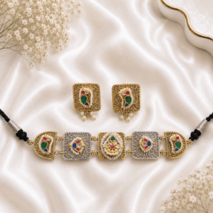 dual-tone silver and gold antique choker necklace paneling with matching square stud earrings, featuring multicolor Kundan glass stones, fine engraved patterns, and delicate pearl detailing on a white satin backdrop.