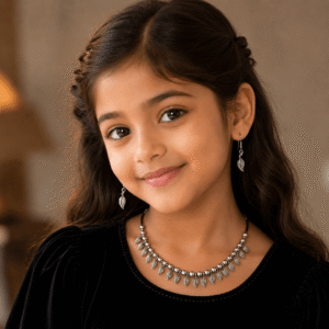 Young girl wearing leaf design silver necklace with matching leaf earrings