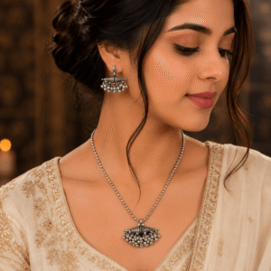 Beautiful girl wearing traditional oxidised silver ghungroo necklace set with matching earrings