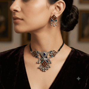 Woman wearing Afghani oxidised multicolor choker necklace with matching earrings.