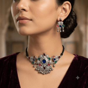 Woman wearing Afghani oxidised multicolor choker necklace with matching earrings.