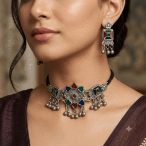 Woman wearing Afghani oxidised multicolor choker necklace with matching earrings.
