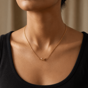 Anti tarnish gold necklace with elegant knot pendant, fine chain design and minimal everyday jewellery style worn on neck.