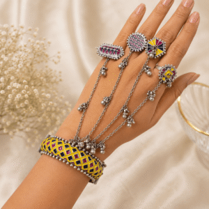 Premium German silver multicolor hand pancho with colorful enamel design worn on a woman's hand.