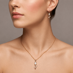 Gold plated floral pendant necklace with matching earrings worn by model