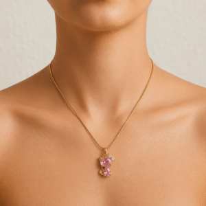 Woman wearing a gold-plated stainless steel necklace with a sparkling pink crystal teddy bear pendant, perfect for everyday wear and gifting.