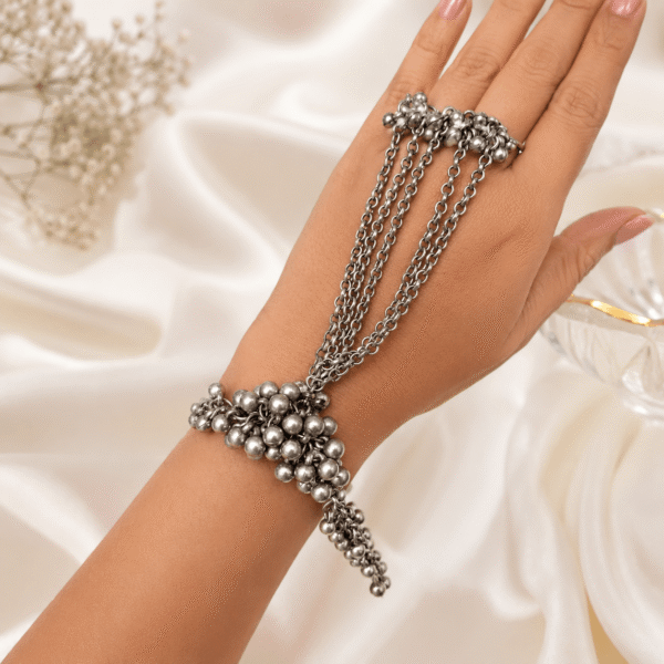 Premium oxidized silver hand pancho bracelet with chain design worn on a woman's hand for ethnic and boho fashion.