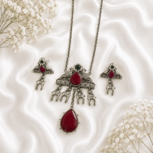silver long necklace set with red stone, deer charms, and matching earrings for women