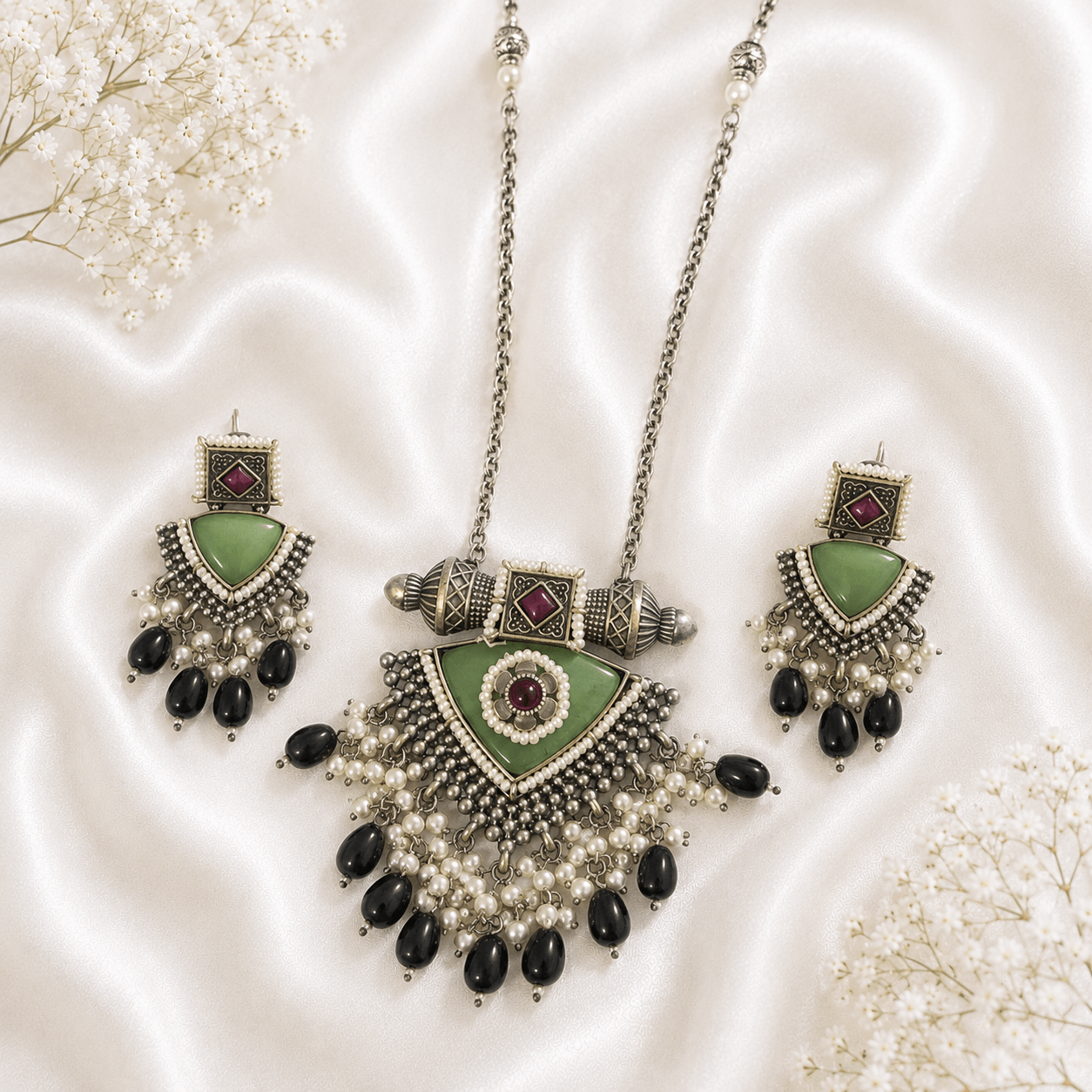 silver green stone statement necklace set with pearl tassels, black bead drops, and matching earrings for women