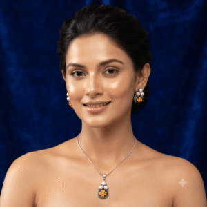 Woman wearing a premium silver finish floral pearl pendant necklace with matching pearl stud earrings featuring green flower detailing.