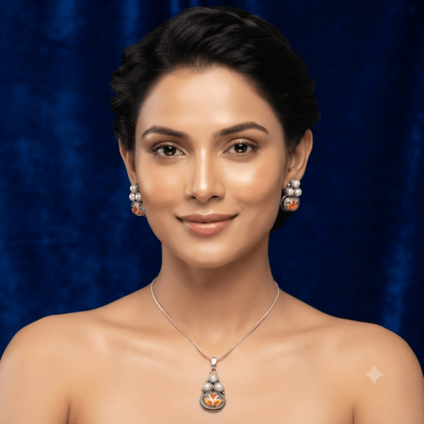 Woman wearing a premium silver finish floral pearl pendant necklace with matching pearl stud earrings featuring white flower detailing.
