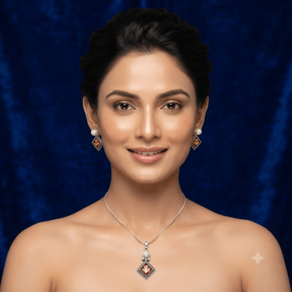Woman wearing a premium silver finish floral pendant necklace with matching pearl stud earrings featuring a pink floral design.