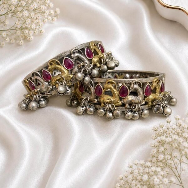 German silver peacock kada pair with pink stones, gold and silver peacock motifs and hanging ghungroo beads