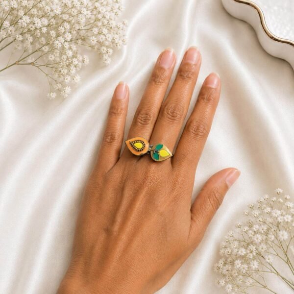 Gold-tone open ring with yellow and green leaf-shaped stone detailing