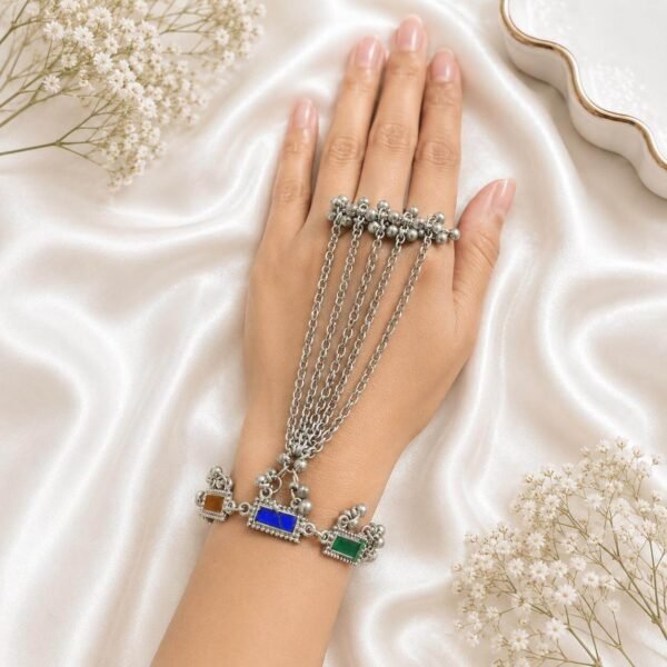 Oxidised silver multi-chain haath phool with red and green stone detailing