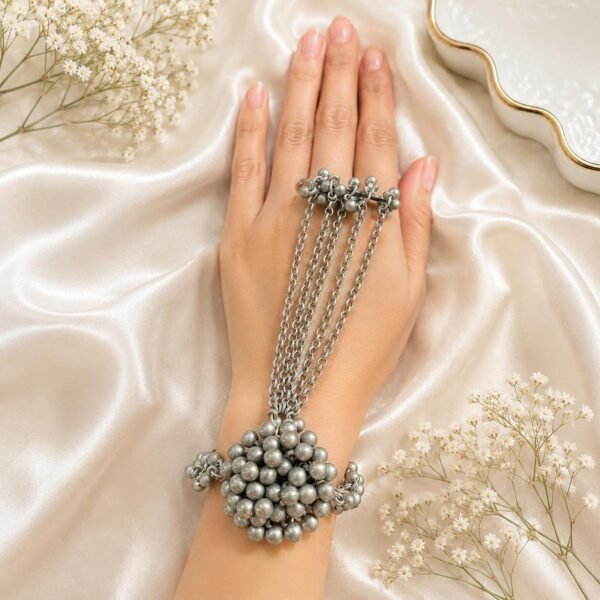 Oxidised silver multi-chain haath phool with red and blue stone detailing