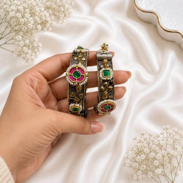 Traditional silver kada with green and pink stones and pearl detailing