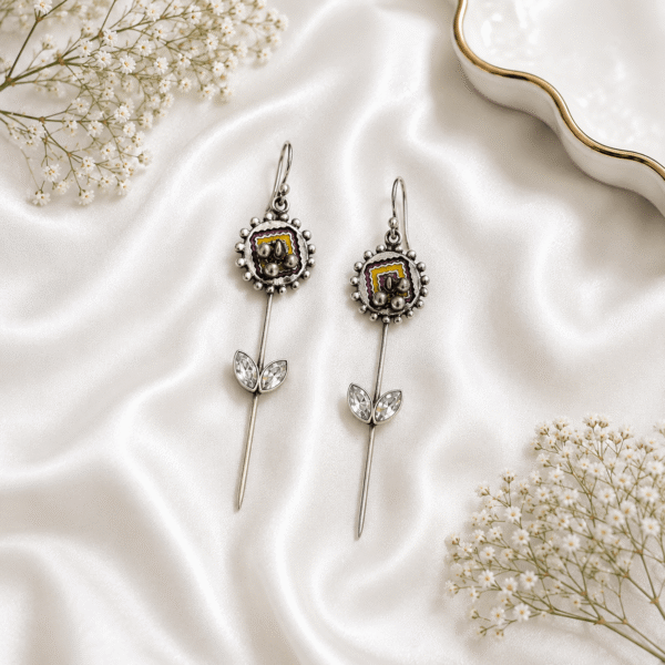 Woman wearing a premium German silver ear cuff earring with green stone and pearl detailing on the right ear.